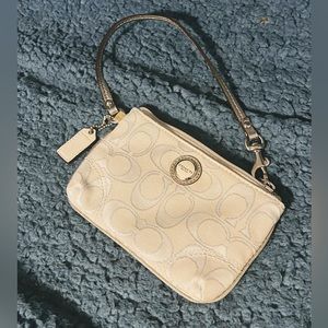 White and silver COACH wristlet🤍 given as a purchase gift 🤍